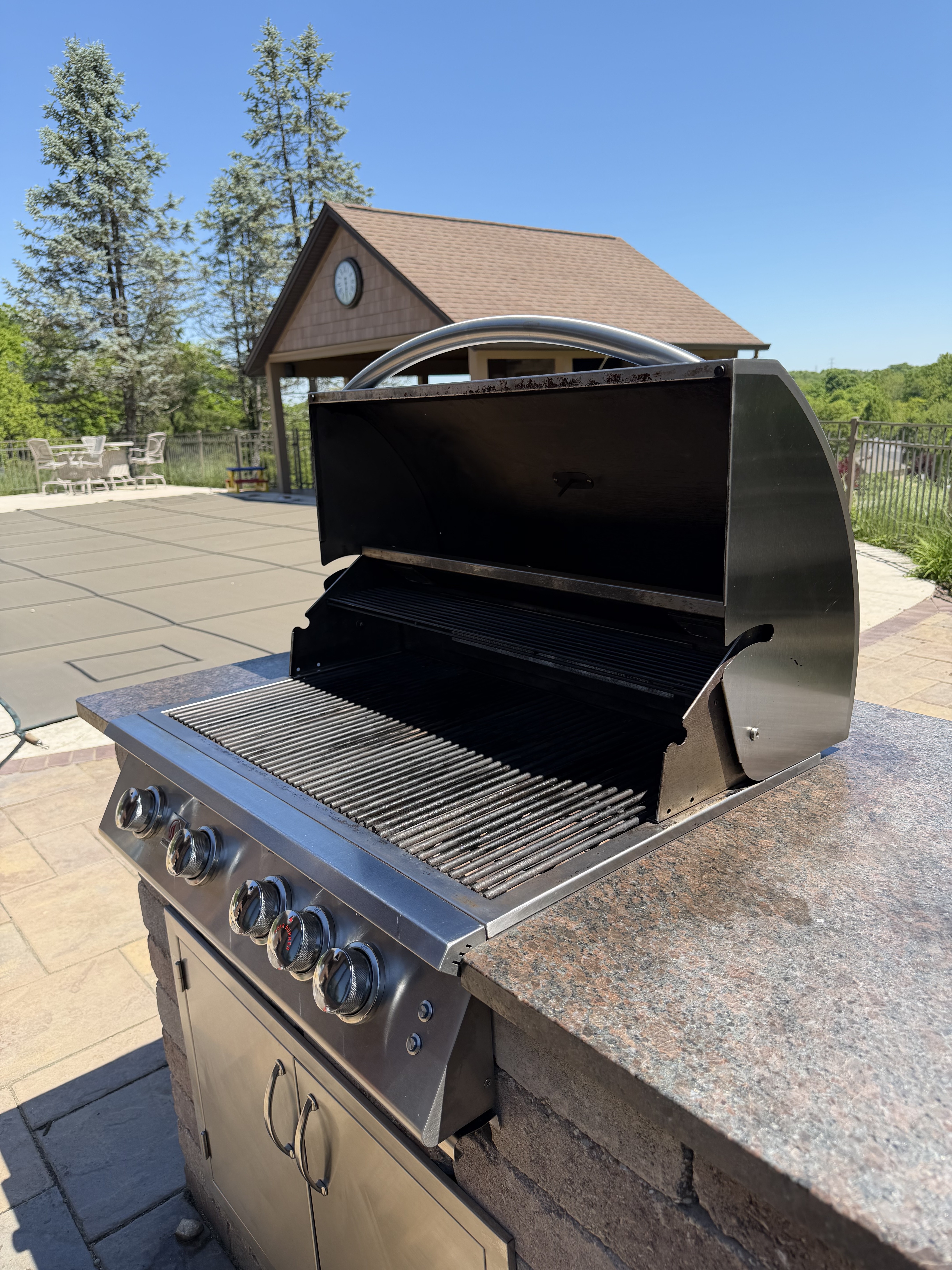 After: the same 5-burner built-in with a clean, polished cookbox and restored grates